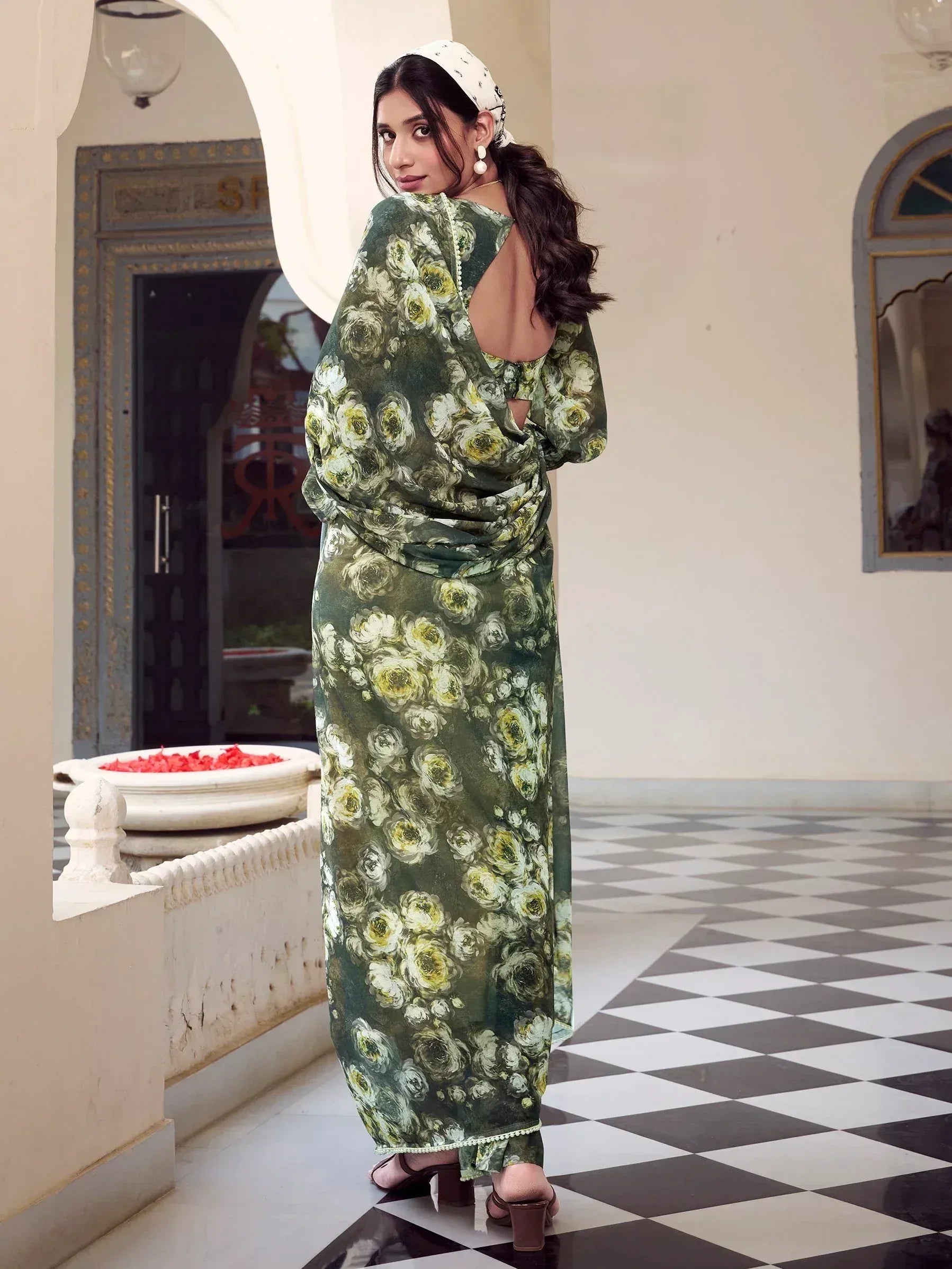 Green floral ethnic gown with back cutout, styled with headscarf for Indian occasions