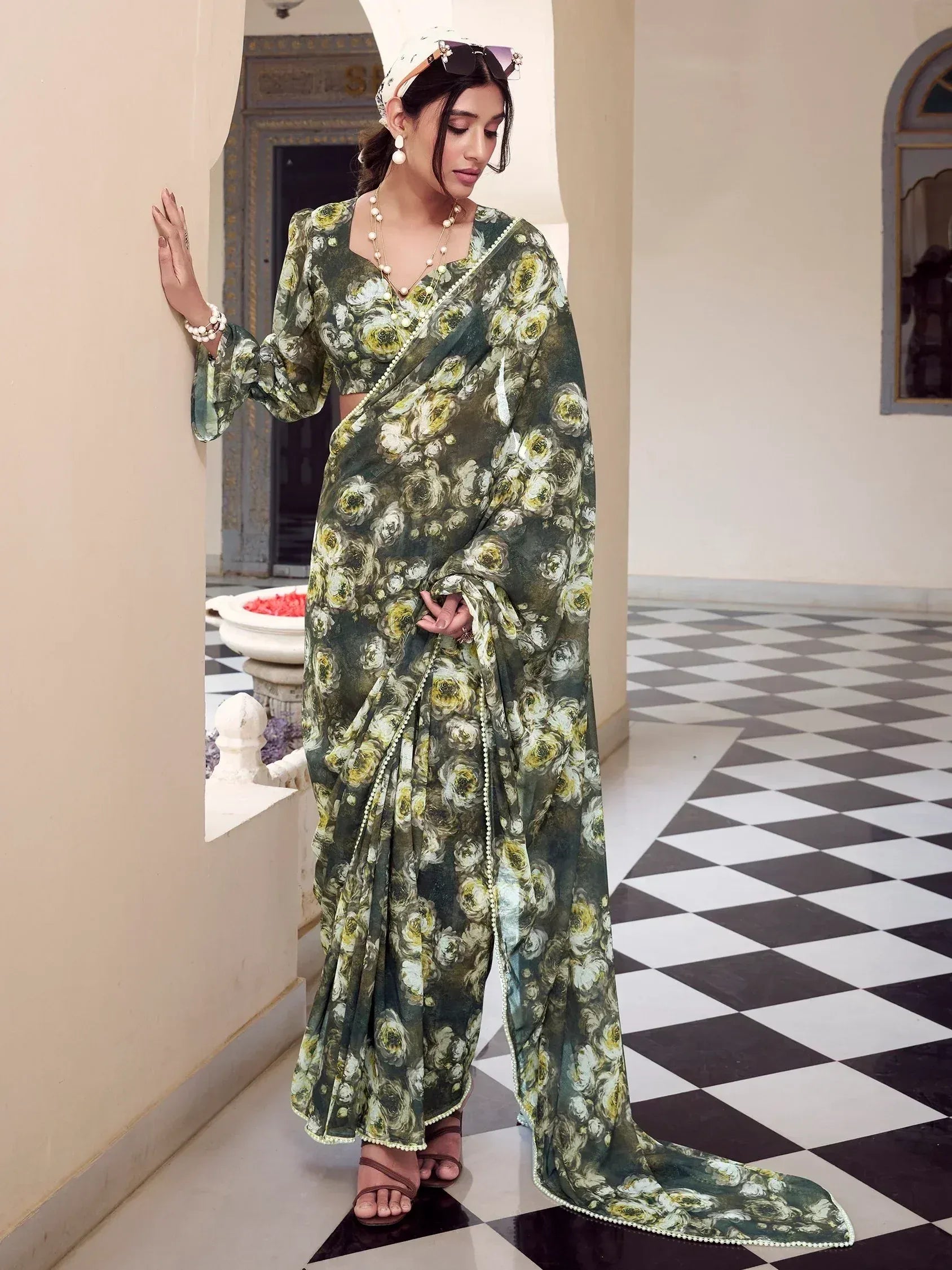 Green floral printed saree with pearl trim, styled with blouse and headscarf for ethnic wear