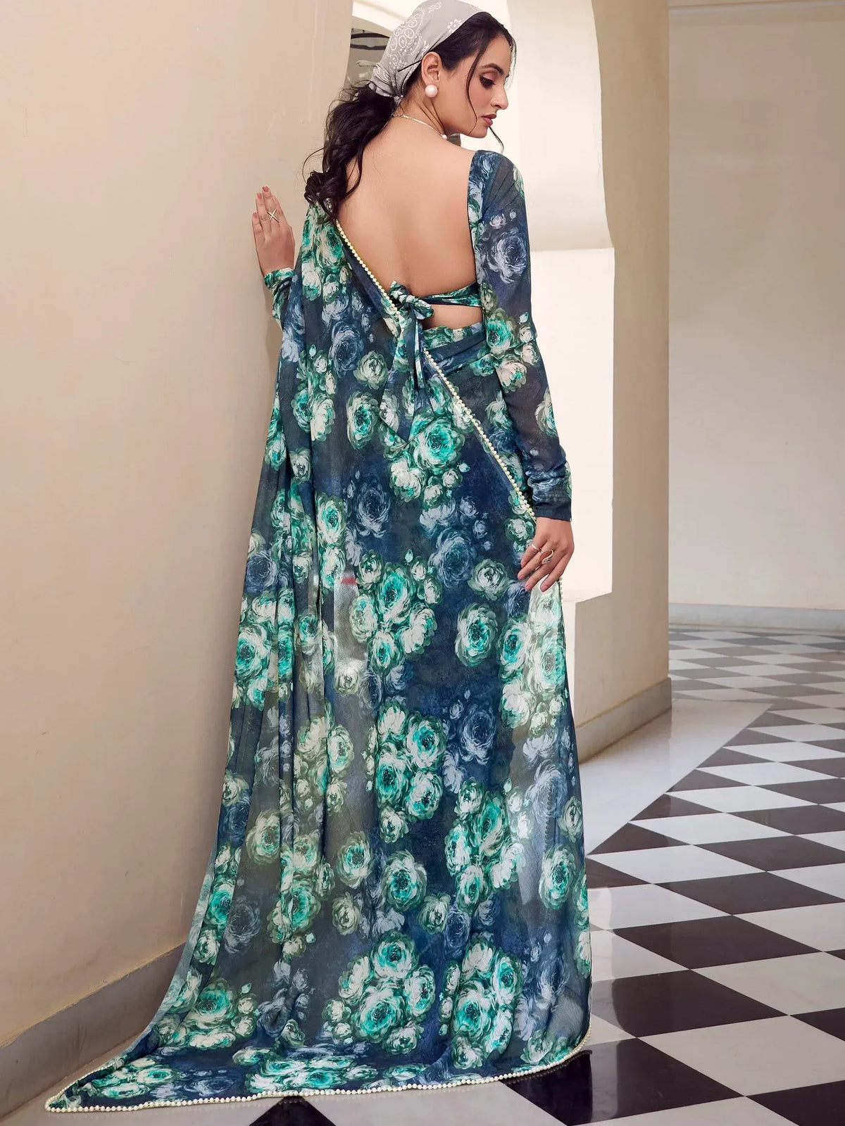 Floral print ethnic gown with backless design and pearl trim, perfect for Indian occasions