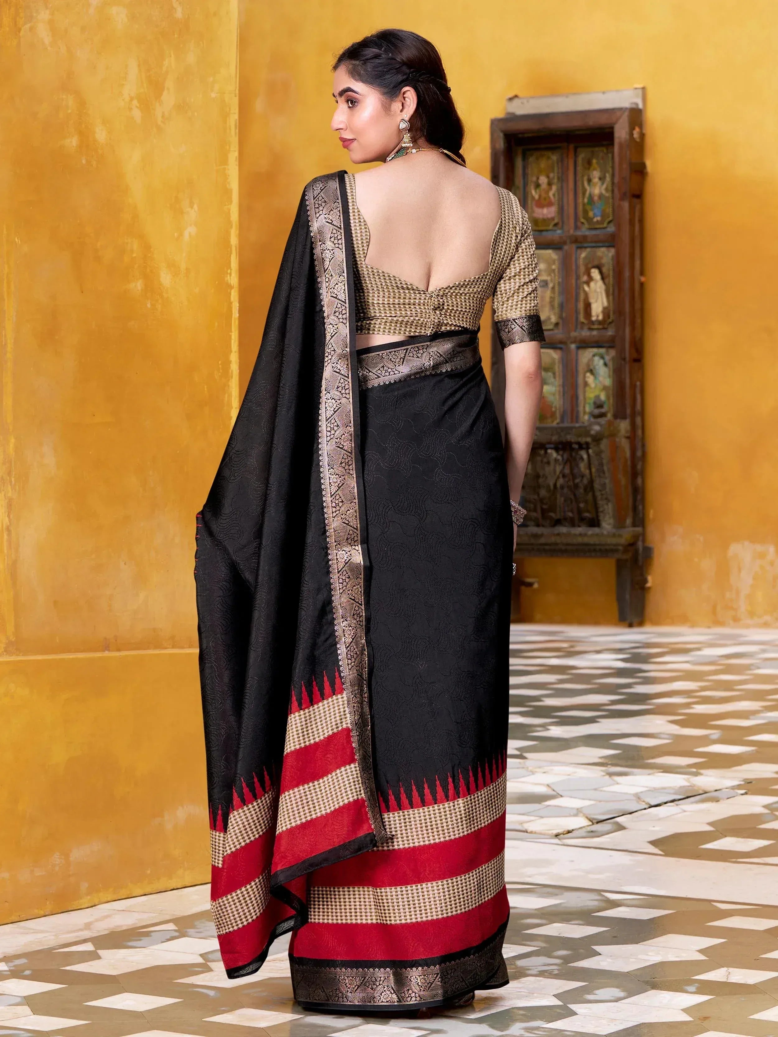 Black and red ethnic saree with gold blouse, perfect for Indian occasions and festive wear.