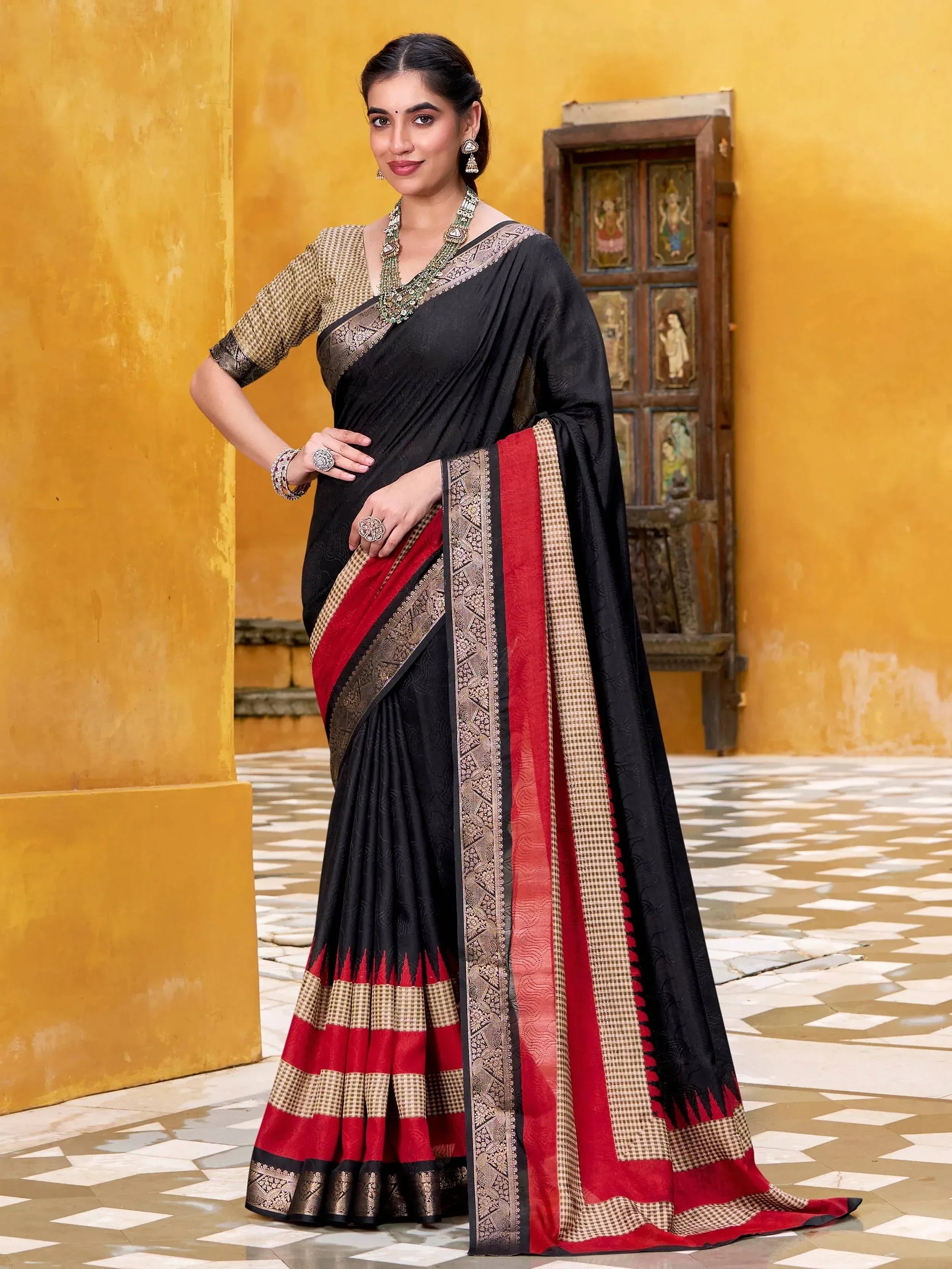 Black and red ethnic saree with gold border, perfect for Indian occasions and festive wear