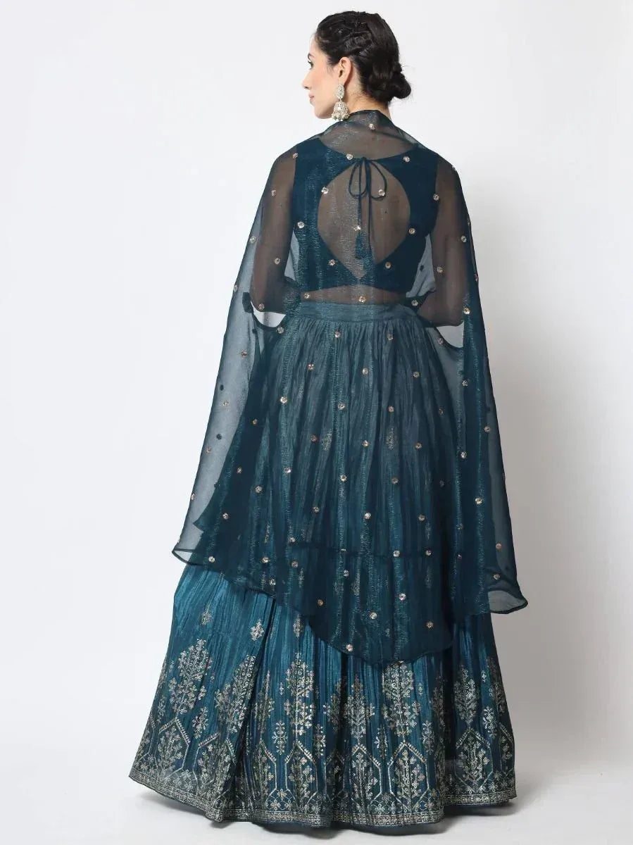 Teal designer lehenga choli with sheer cape and gold embroidery, back view