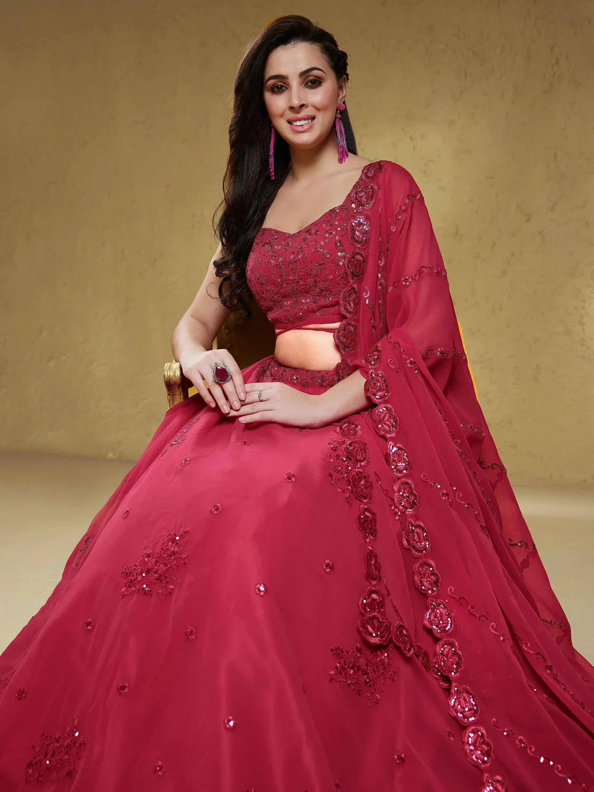 Elegant maroon lehenga choli with floral embroidery and sequins, perfect for Indian weddings and festive occasions.
