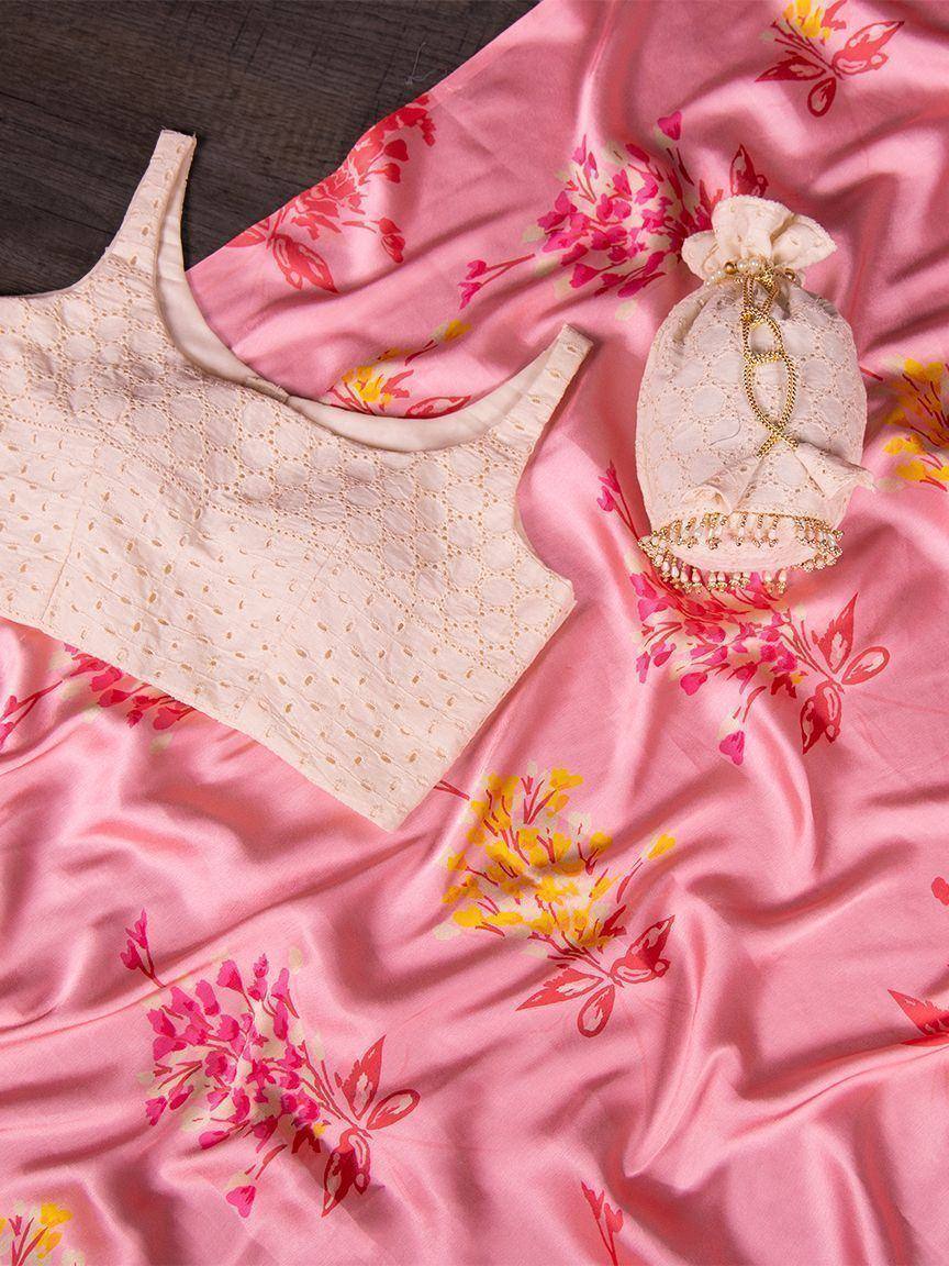 Pink floral printed saree with cream embroidered blouse and potli bag, ethnic Indian wear