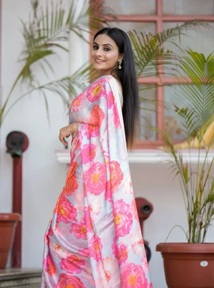 Woman in floral print saree, Indian ethnic wear, pink and white designer saree
