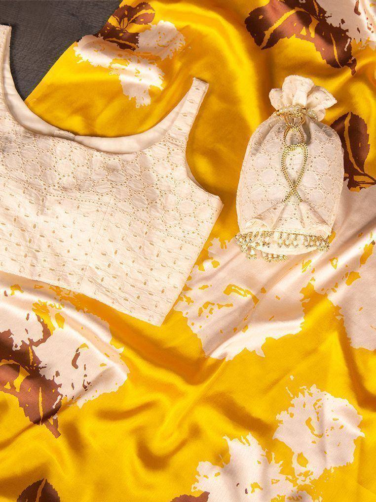 Yellow floral print ethnic gown with lace top and matching potli bag, perfect for Indian occasions