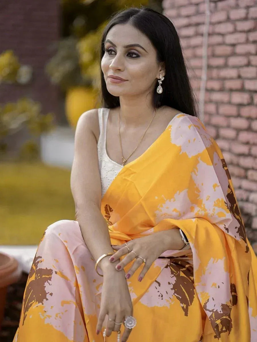 Woman in yellow and pink printed saree with white blouse, elegant ethnic wear for festive occasions