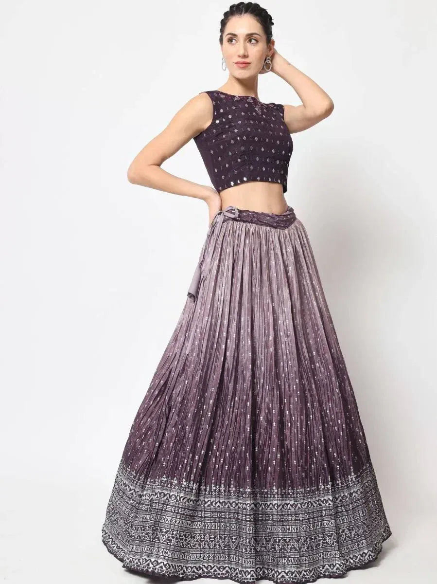 Purple embroidered lehenga choli with pleated skirt and ethnic print, perfect for Indian festive occasions