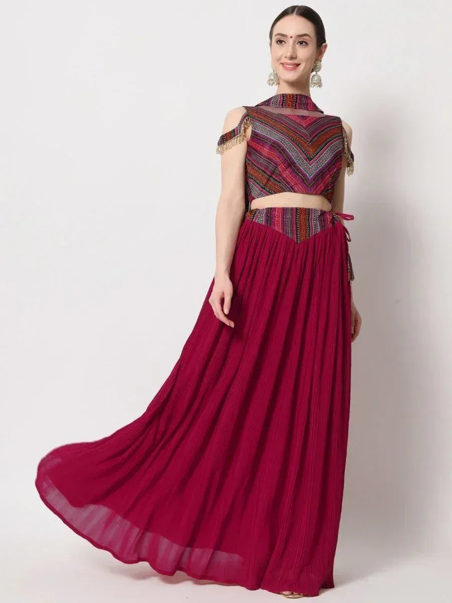 Maroon ethnic gown with patterned crop top and pleated skirt, perfect for Indian festive occasions