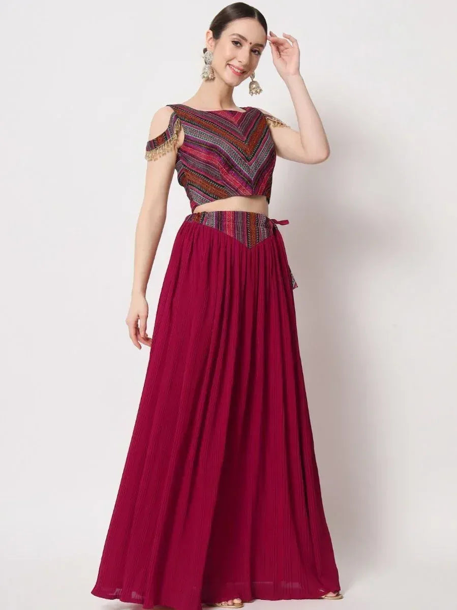 Maroon ethnic gown with patterned crop top and pleated skirt, perfect for Indian occasions