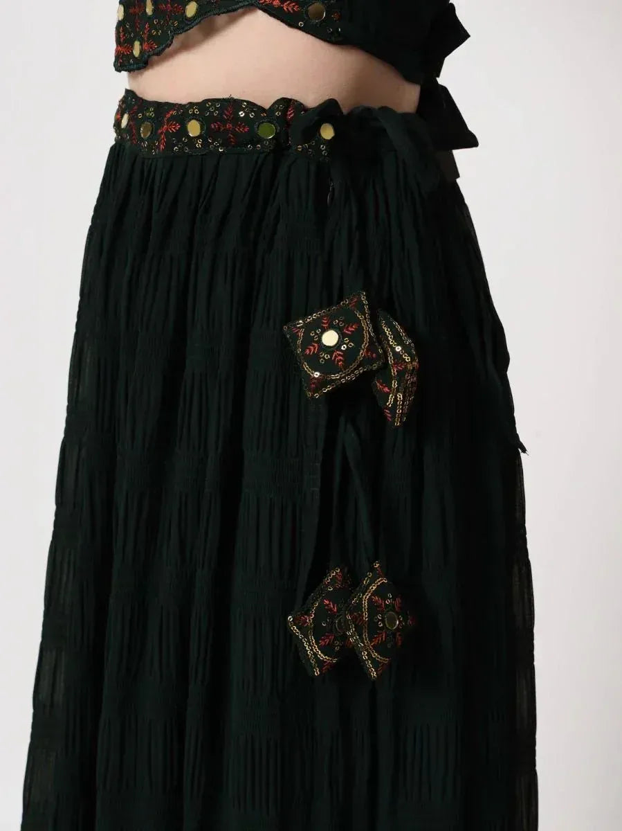 Black ethnic skirt with embroidered patches and sequin detailing, paired with matching crop top