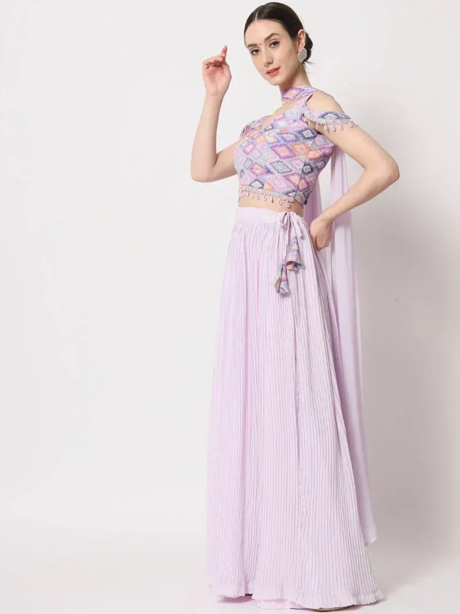 Lavender ethnic gown with printed crop top and pleated skirt, perfect for Indian occasions