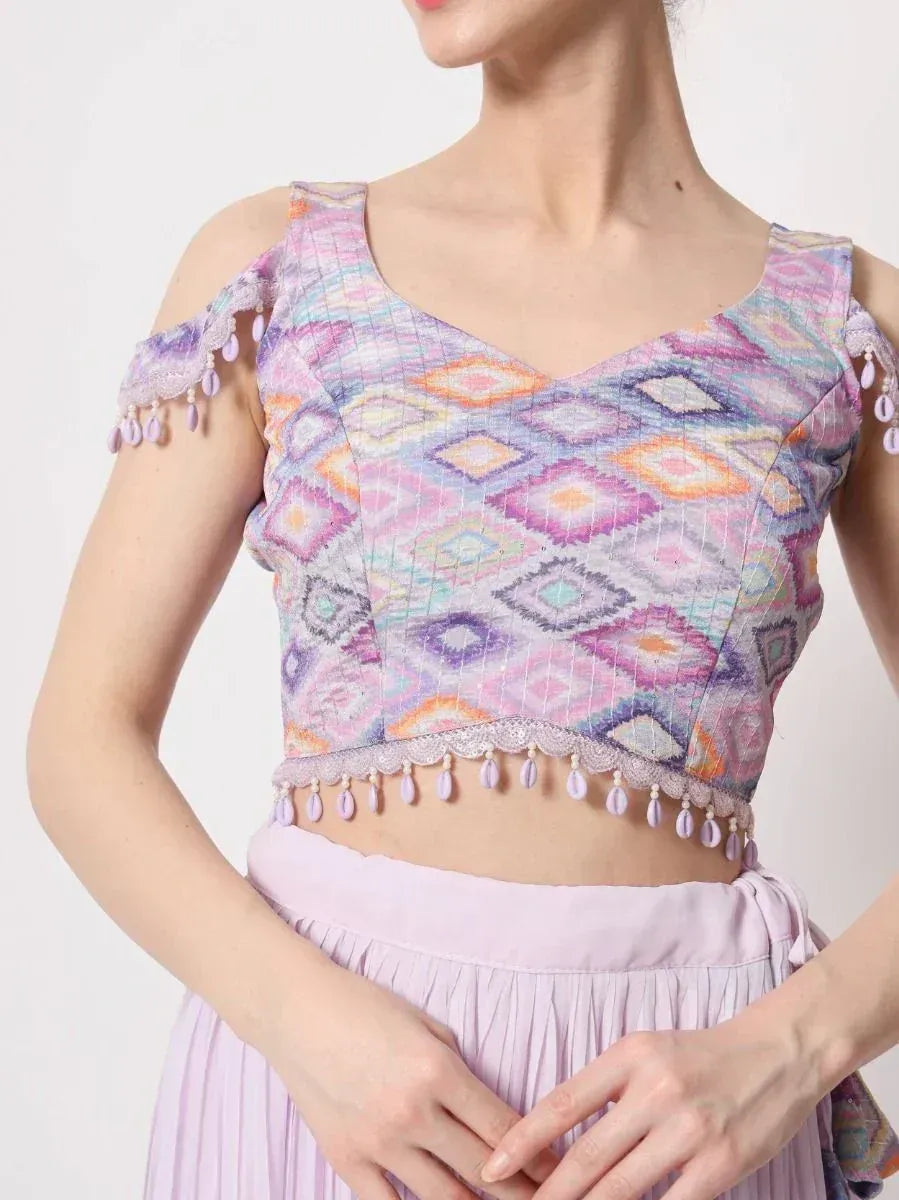 Pastel ethnic crop top with geometric print, cold shoulder, and tassel trim for lehenga or saree