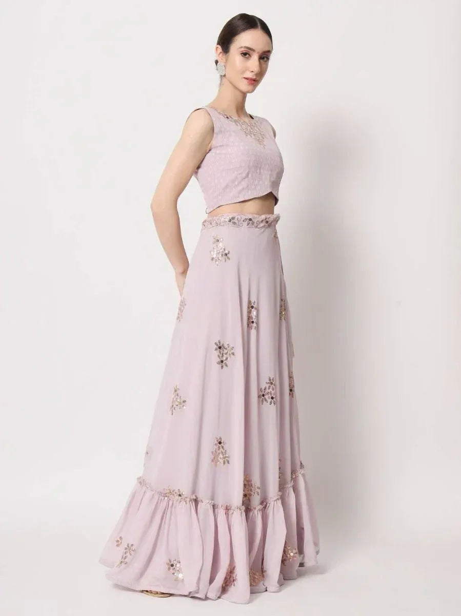 Lavender ethnic lehenga choli with floral embroidery and ruffled hem, perfect for Indian weddings and parties