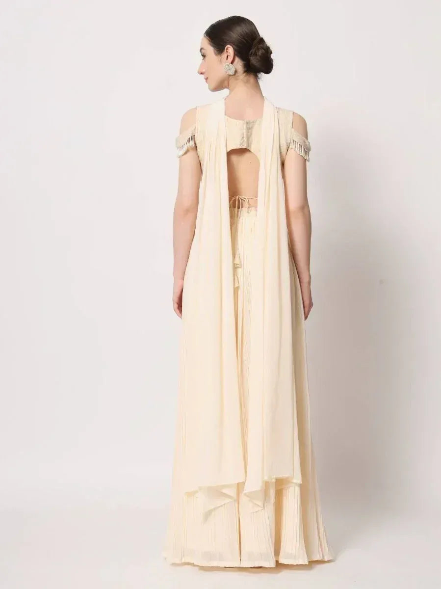 Cream ethnic gown with cold shoulder sleeves and pleated palazzo pants, back view