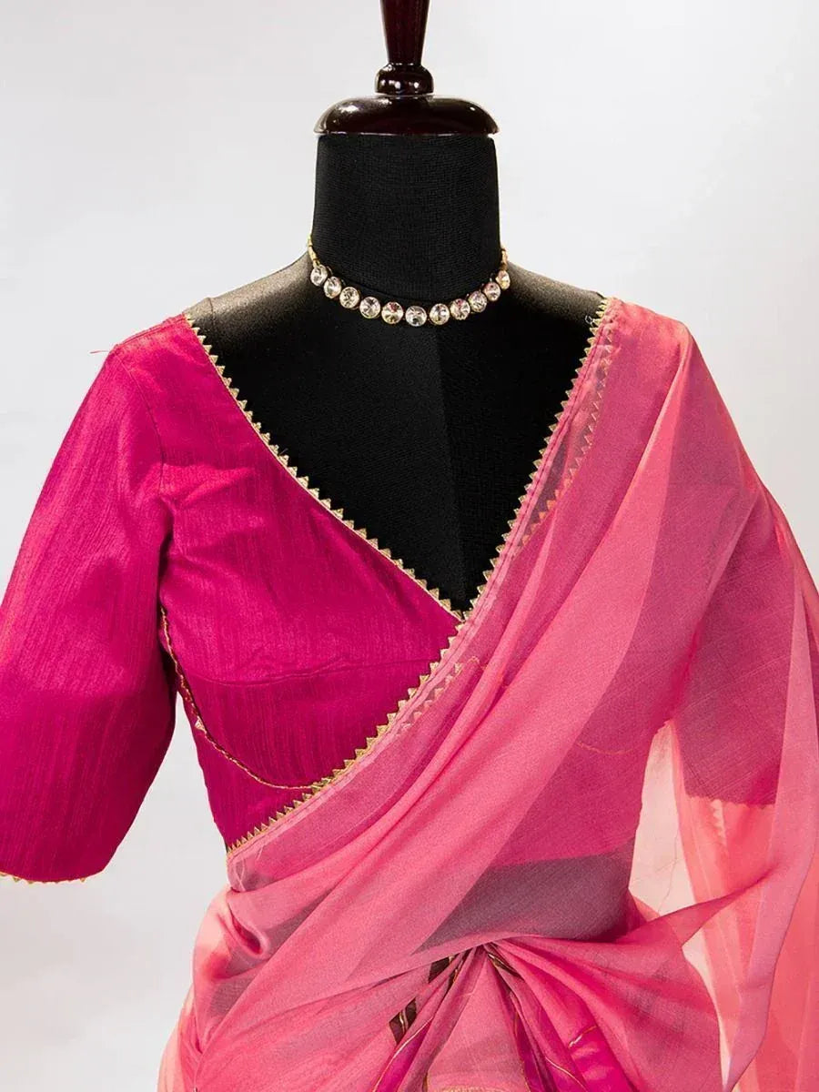Pink ethnic saree with gold trim and matching blouse, styled on mannequin for Indian wear