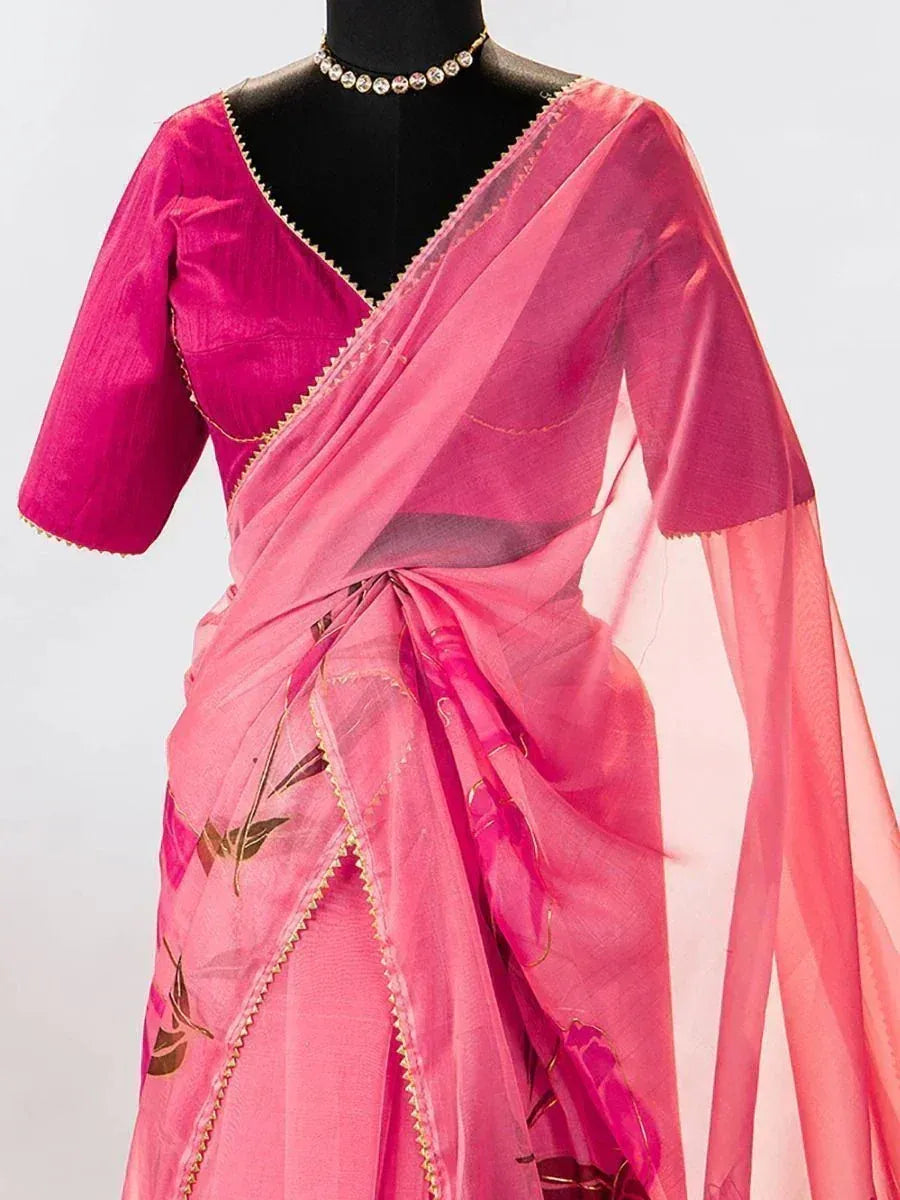 Pink floral saree with gold trim and matching blouse, elegant Indian ethnic wear