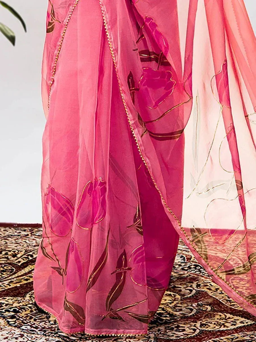 Pink floral embroidered saree with gold trim, elegant Indian ethnic wear