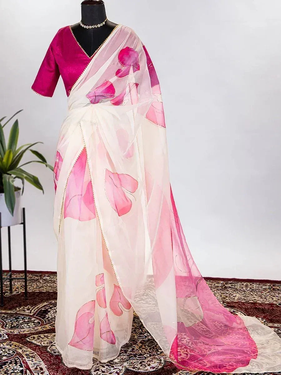 White saree with pink floral print, paired with magenta blouse, elegant ethnic wear for women
