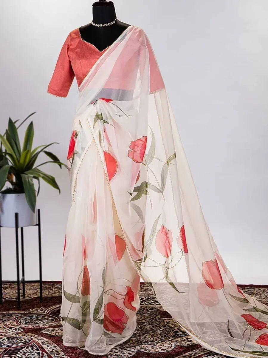 White saree with pink floral print, paired with coral blouse, elegant ethnic wear for women