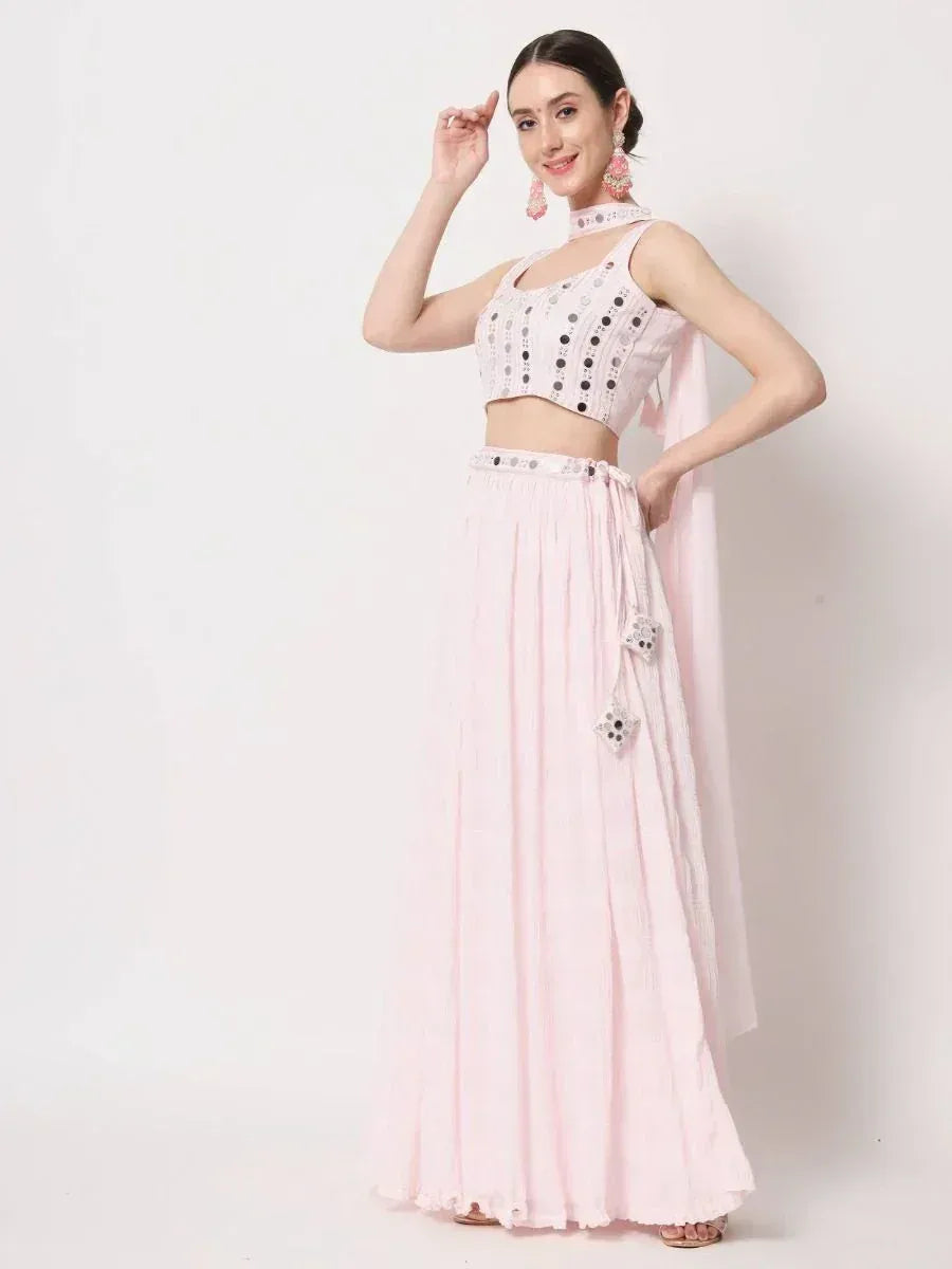Pink ethnic lehenga choli with mirror work, perfect for Indian weddings and festive occasions