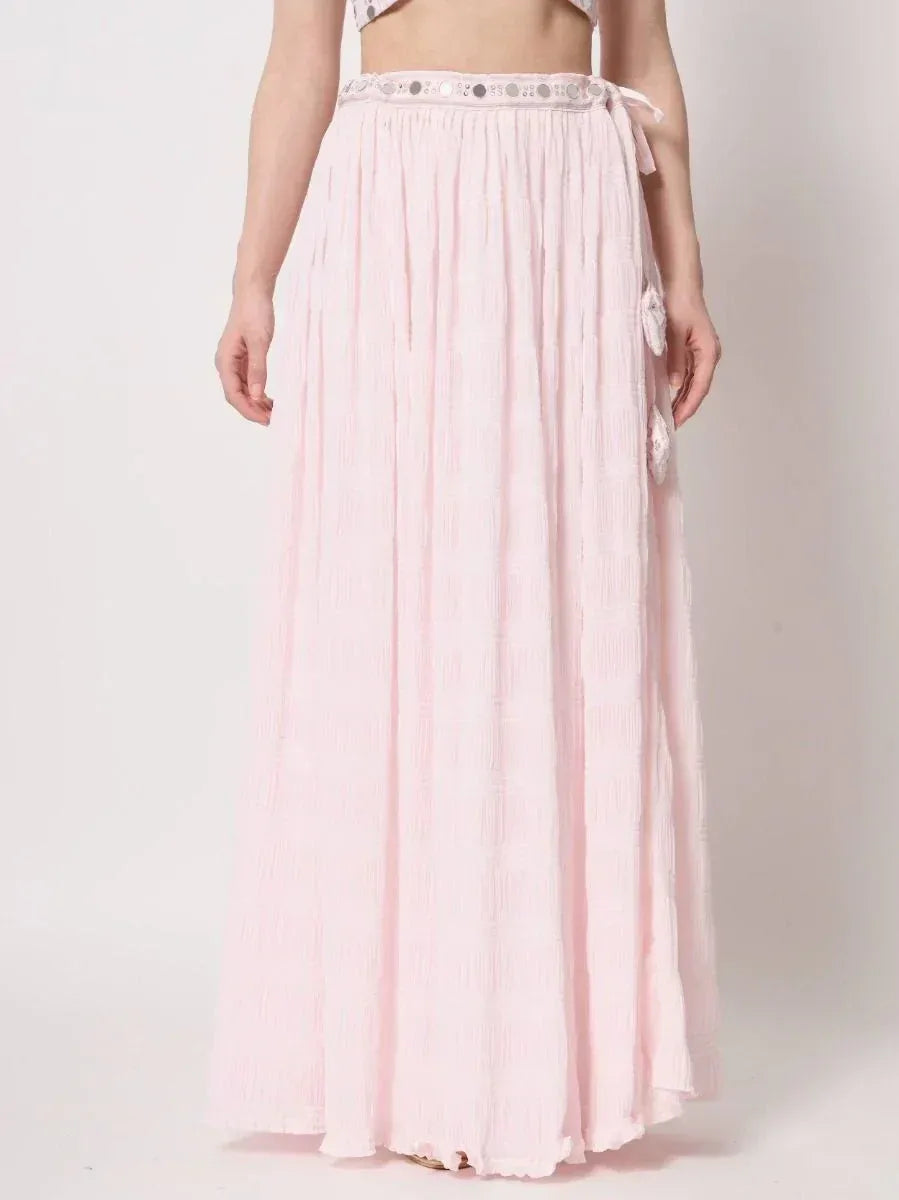 Pink pleated ethnic maxi skirt with sequin waistband and side tassels, ideal for Indian wear
