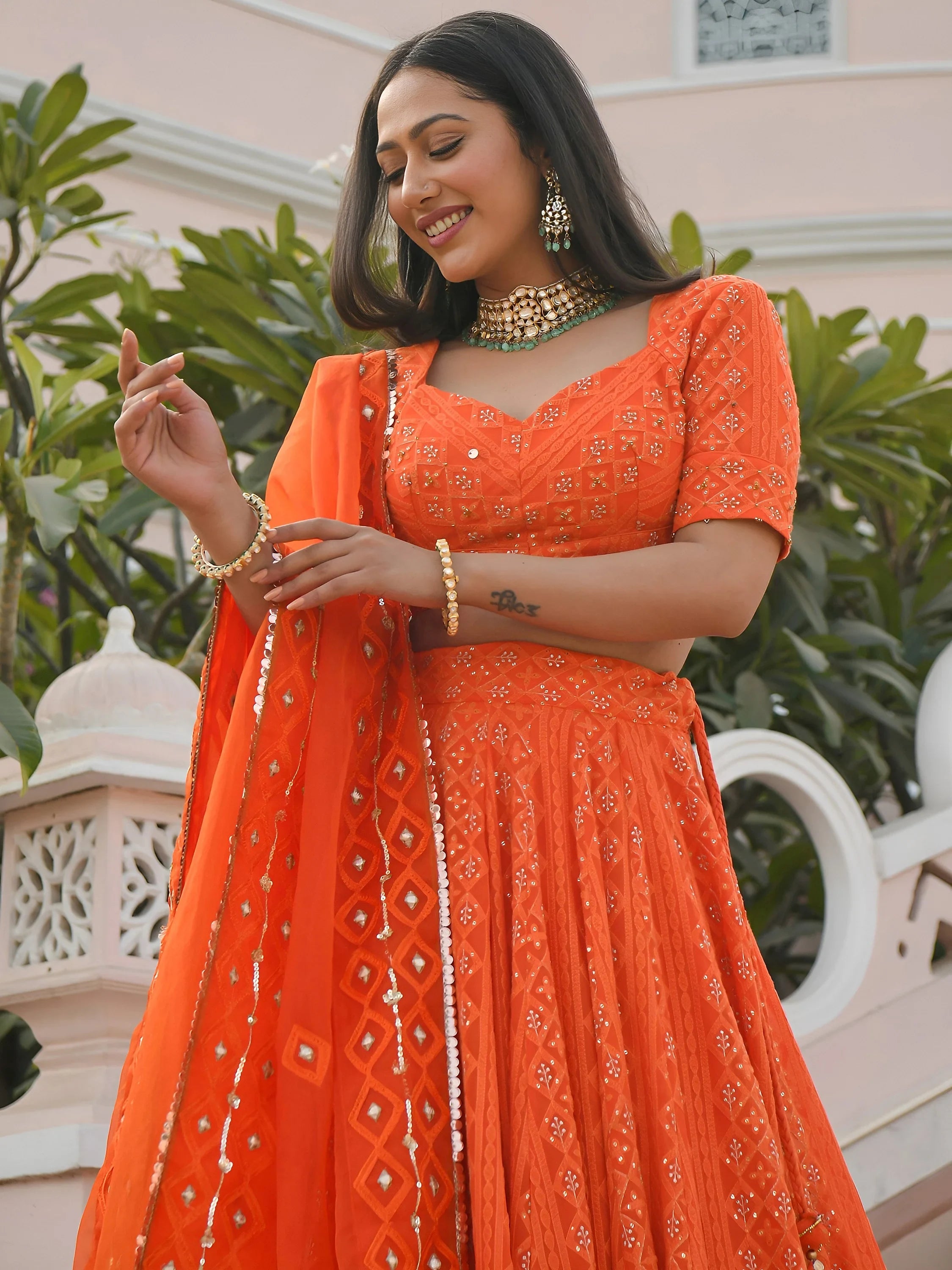 Pretty Orange Sequins Georgette Sangeet Wear Lehenga Choli