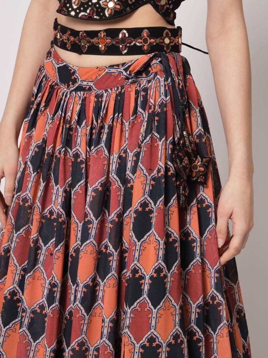 Orange and black printed lehenga skirt with embroidered waistband and crop top