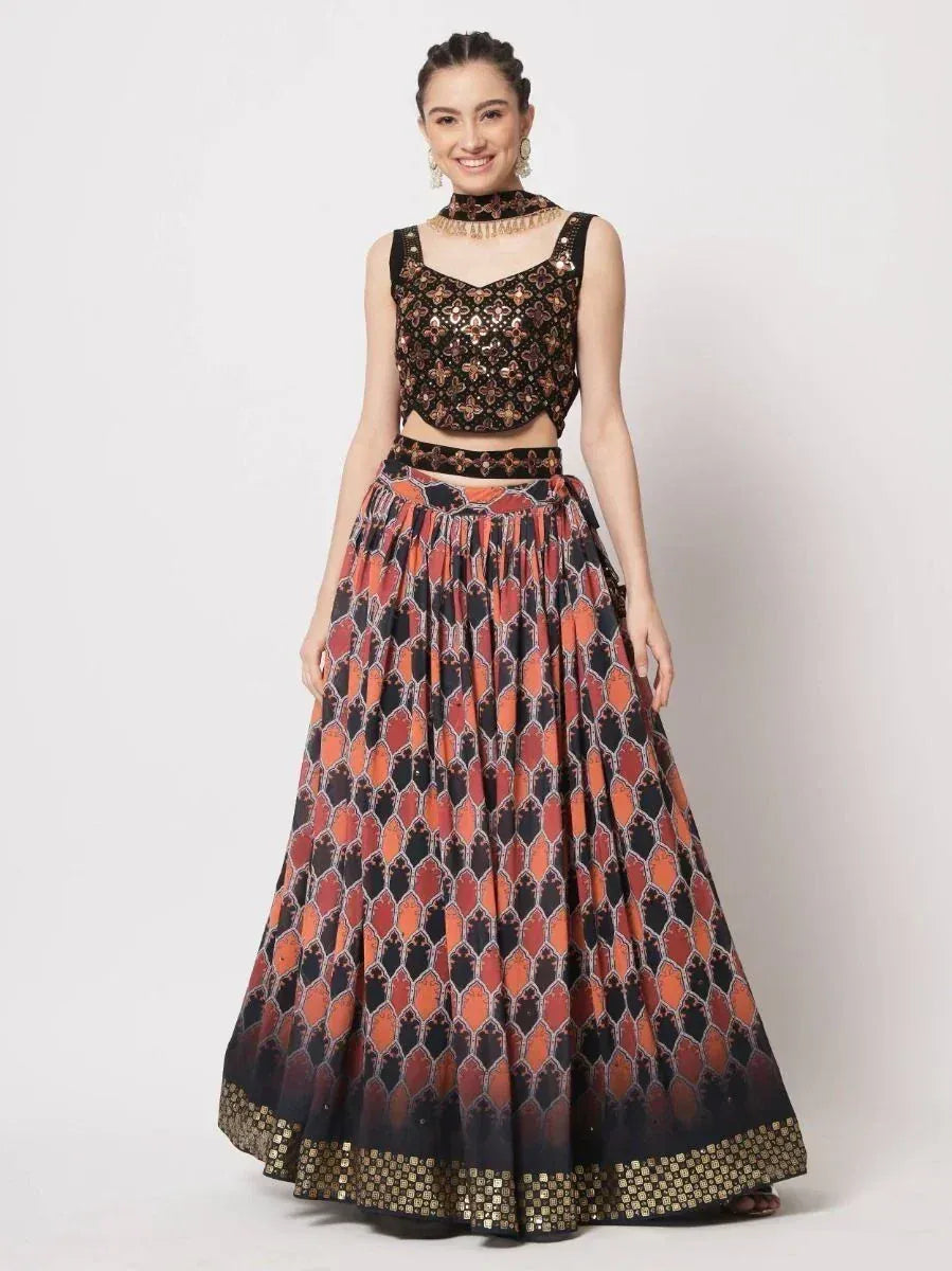 Black and orange printed lehenga choli with sequin top and flared skirt, ethnic Indian wear