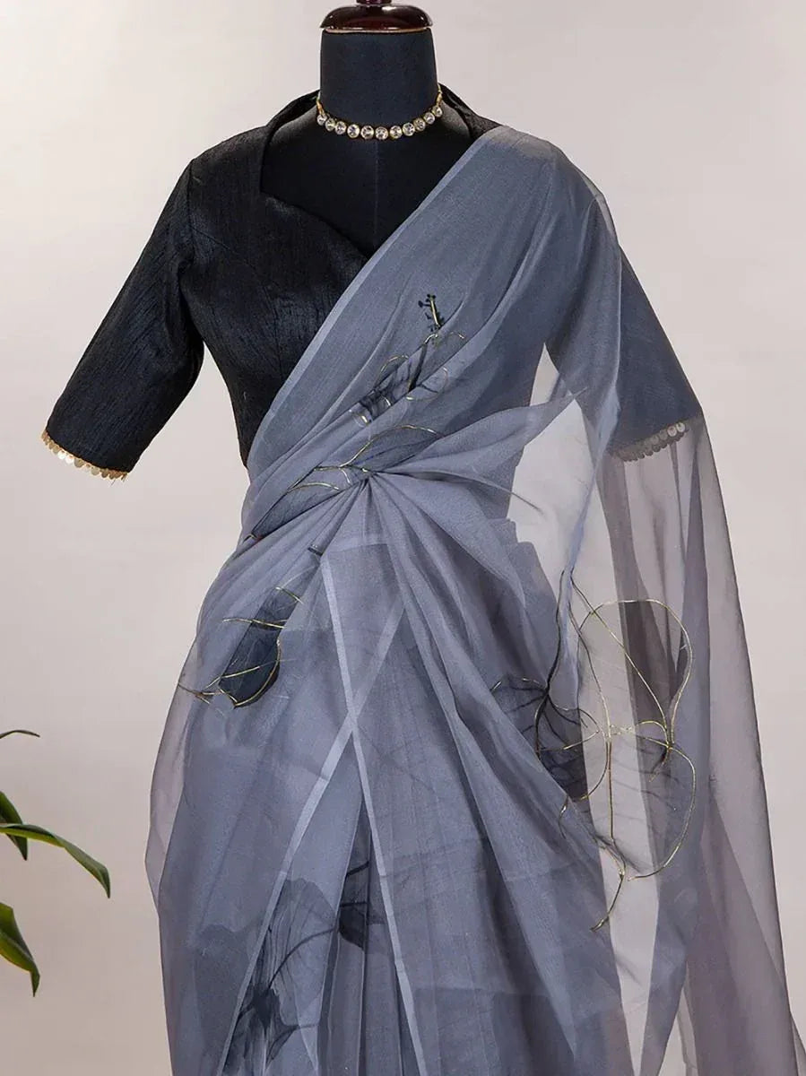 Grey sheer saree with gold thread embroidery, paired with black blouse, elegant ethnic wear for women