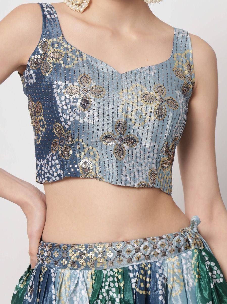 Blue floral embroidered crop top with sequins, paired with matching ethnic skirt for festive wear