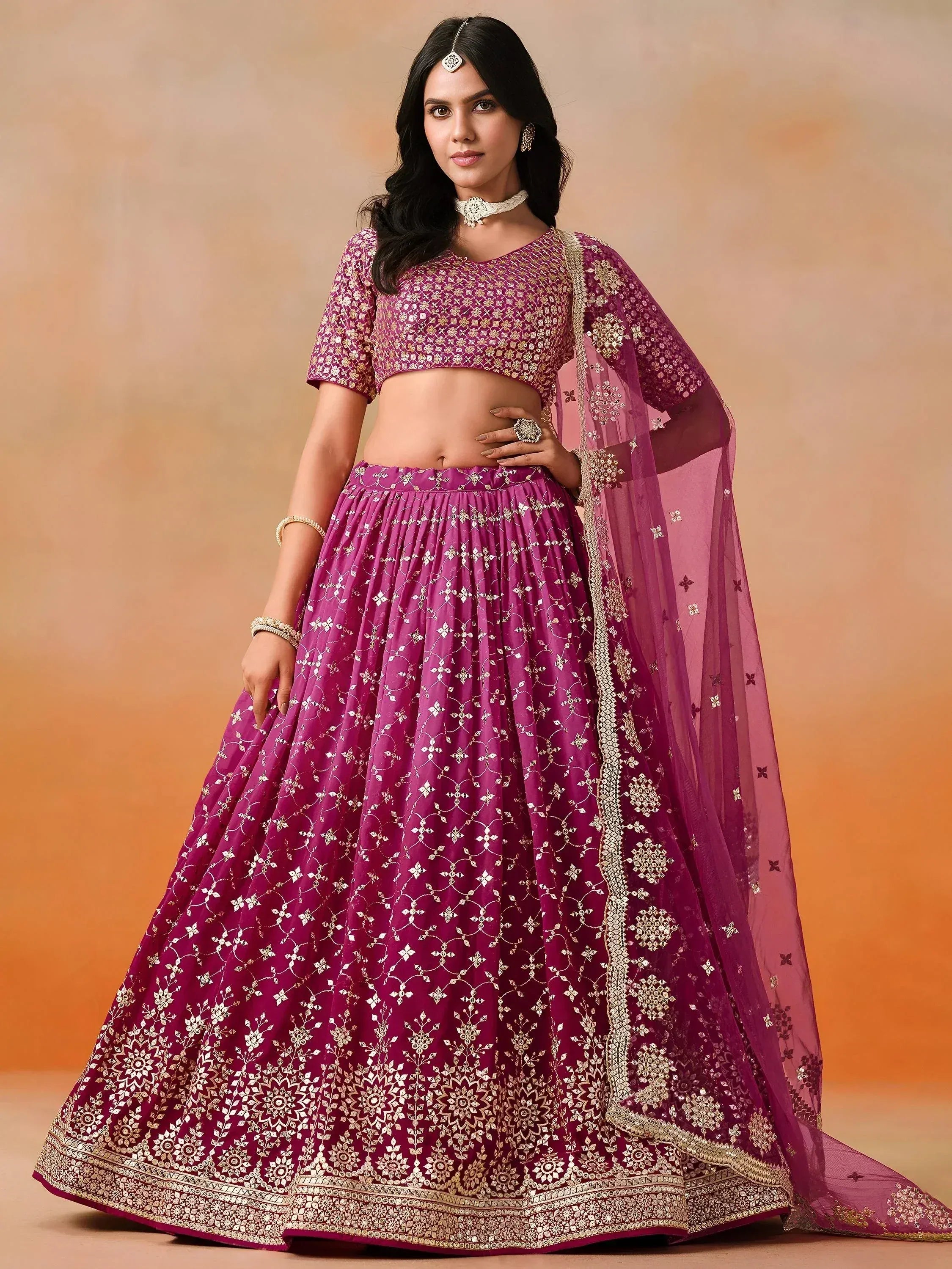 Purple designer lehenga choli with gold embroidery and matching dupatta for Indian ethnic wear