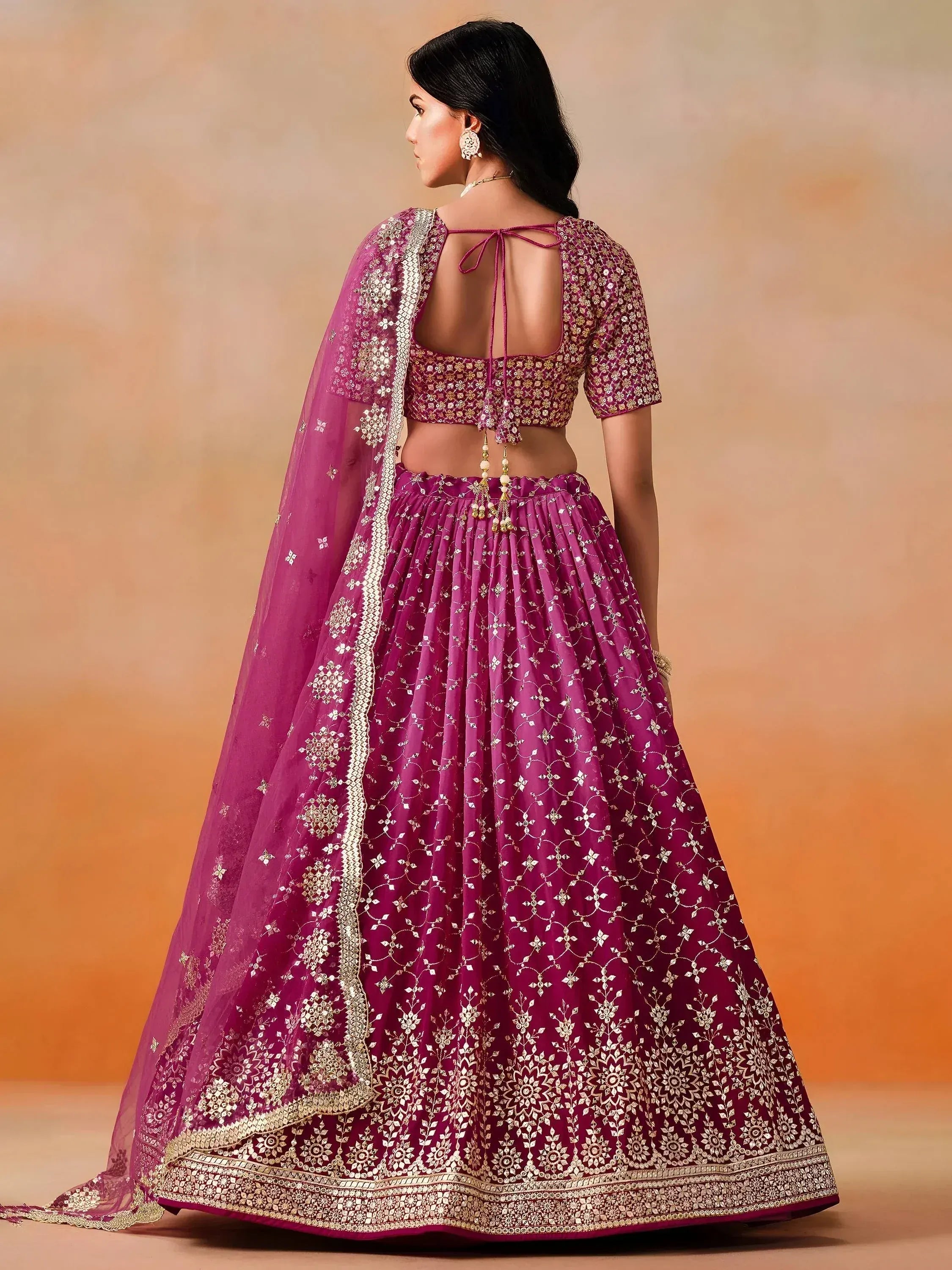 Purple designer lehenga choli with gold embroidery, back view, ethnic wear for women