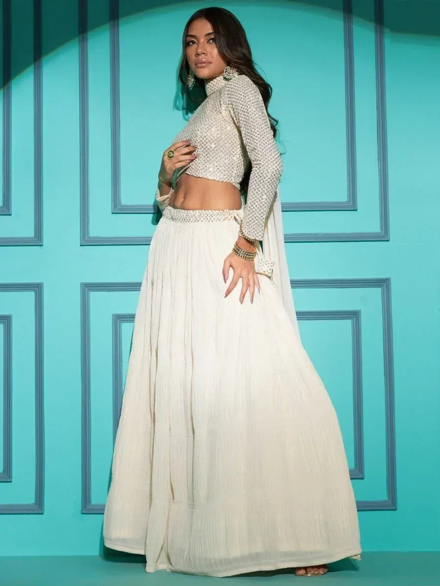 Elegant white lehenga choli with embroidered crop top and pleated skirt, perfect for Indian ethnic occasions