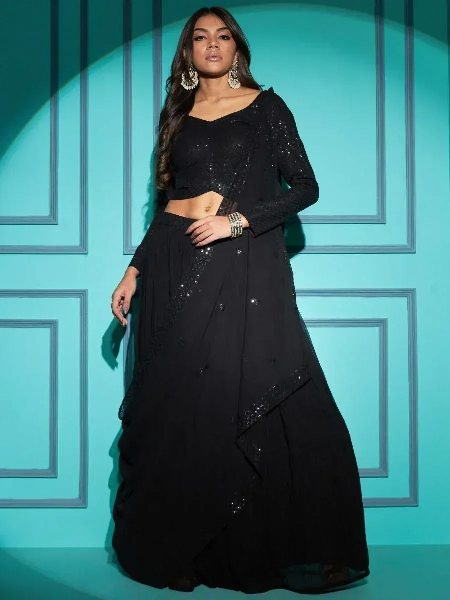 Black sequined lehenga choli with long sleeves, perfect for Indian ethnic wear events
