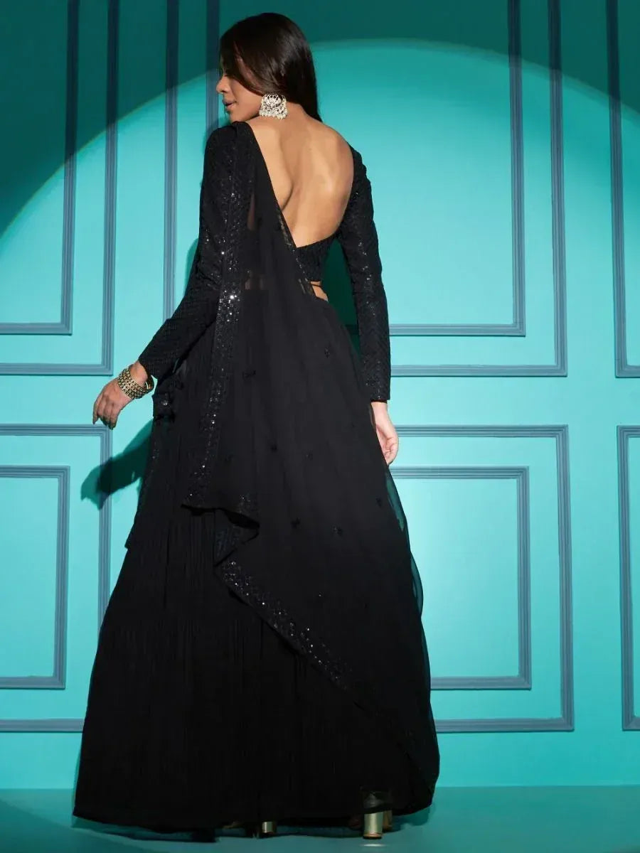 Black designer lehenga choli with backless blouse and sequin detailing, perfect for ethnic events