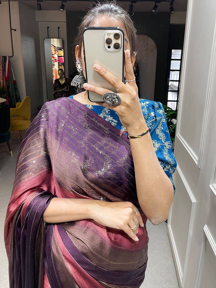 Elegant purple and blue saree with intricate patterns, perfect for ethnic occasions.