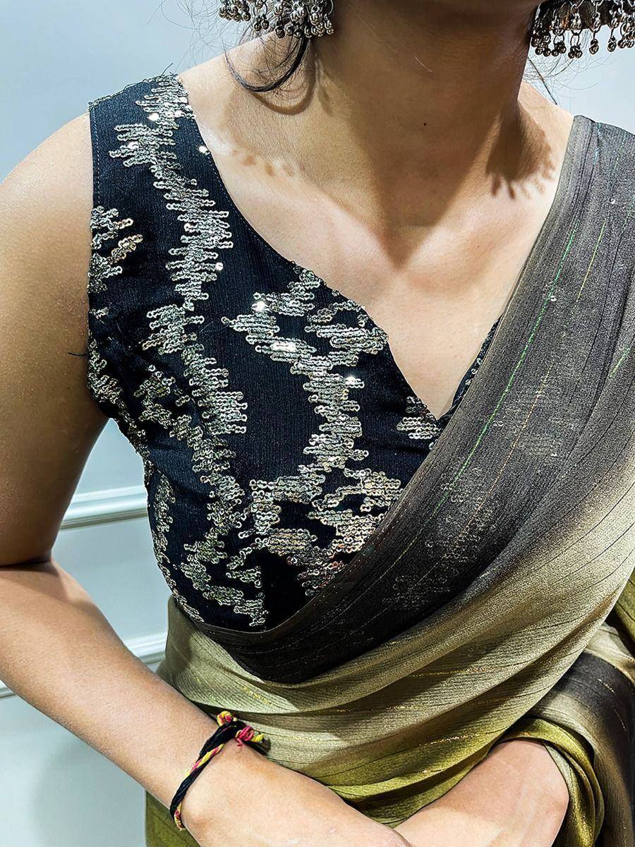 Black sequin blouse with olive saree, perfect for ethnic occasions