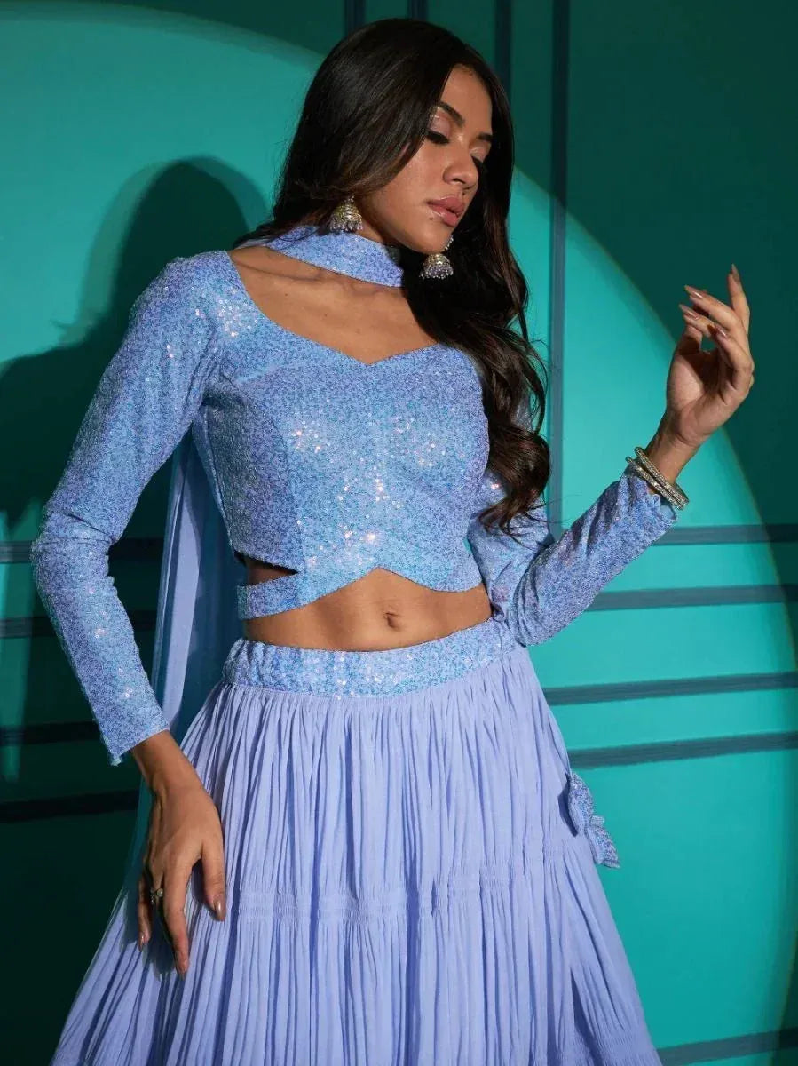 Light blue sequin lehenga choli with long sleeves and pleated skirt, perfect for Indian ethnic wear events.