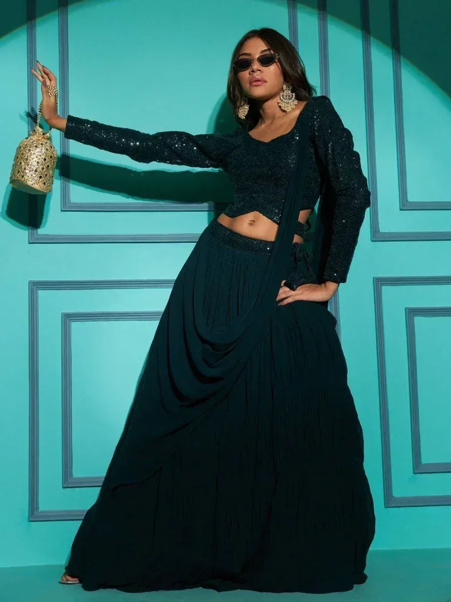 Black sequin lehenga choli with pleated skirt, gold jhumka earrings, and designer potli bag for ethnic wear