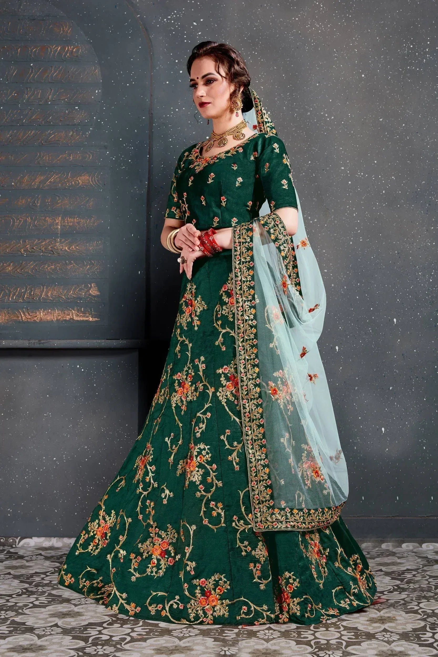 Emerald green designer lehenga choli with floral embroidery and sheer dupatta for Indian ethnic wear