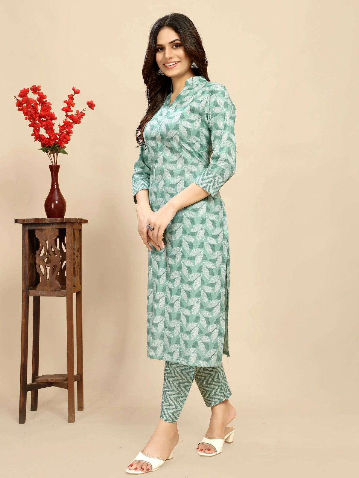 Woman in mint green leaf-print kurta with matching palazzo pants, ethnic wear for women