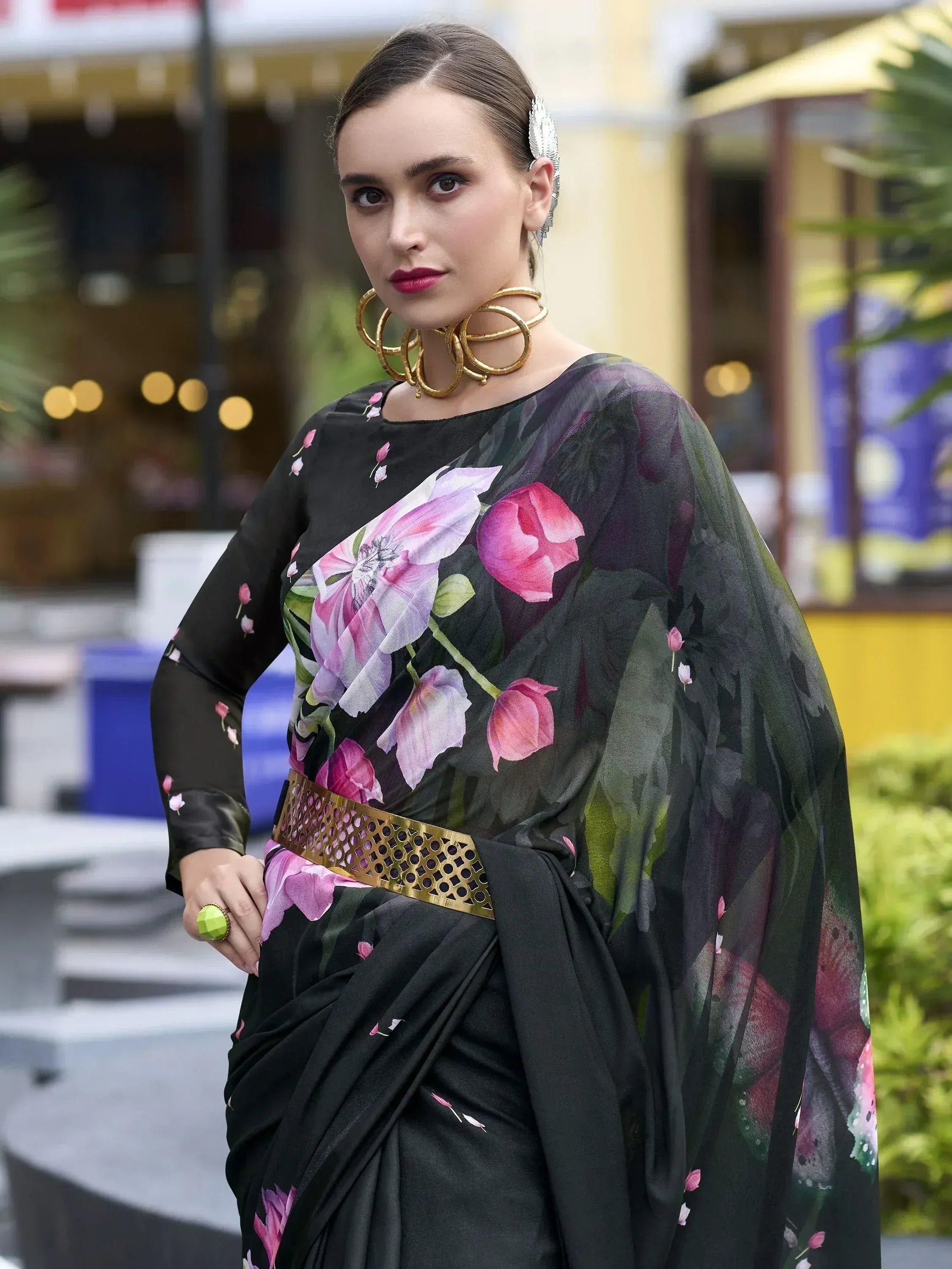 Black floral saree with gold belt, stylish ethnic wear for women, perfect for parties and events.