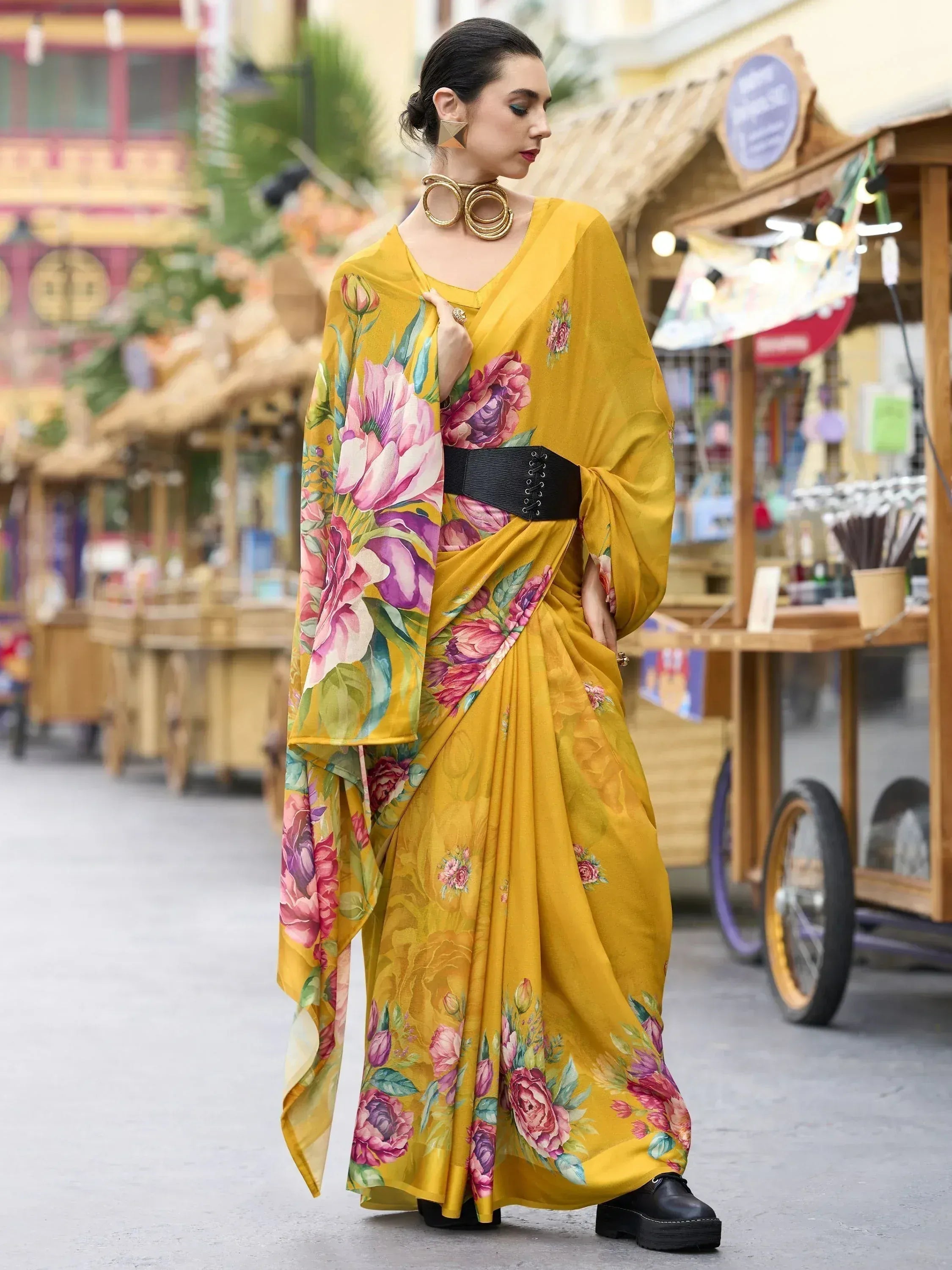 Yellow floral print saree with black belt, styled for ethnic wear, perfect for festive occasions