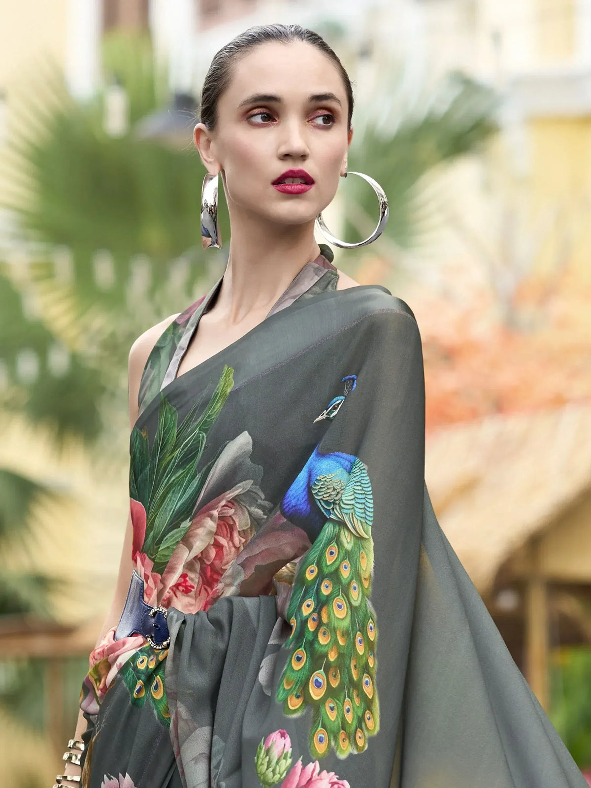 Grey saree with peacock and floral print, styled with statement earrings for ethnic wear