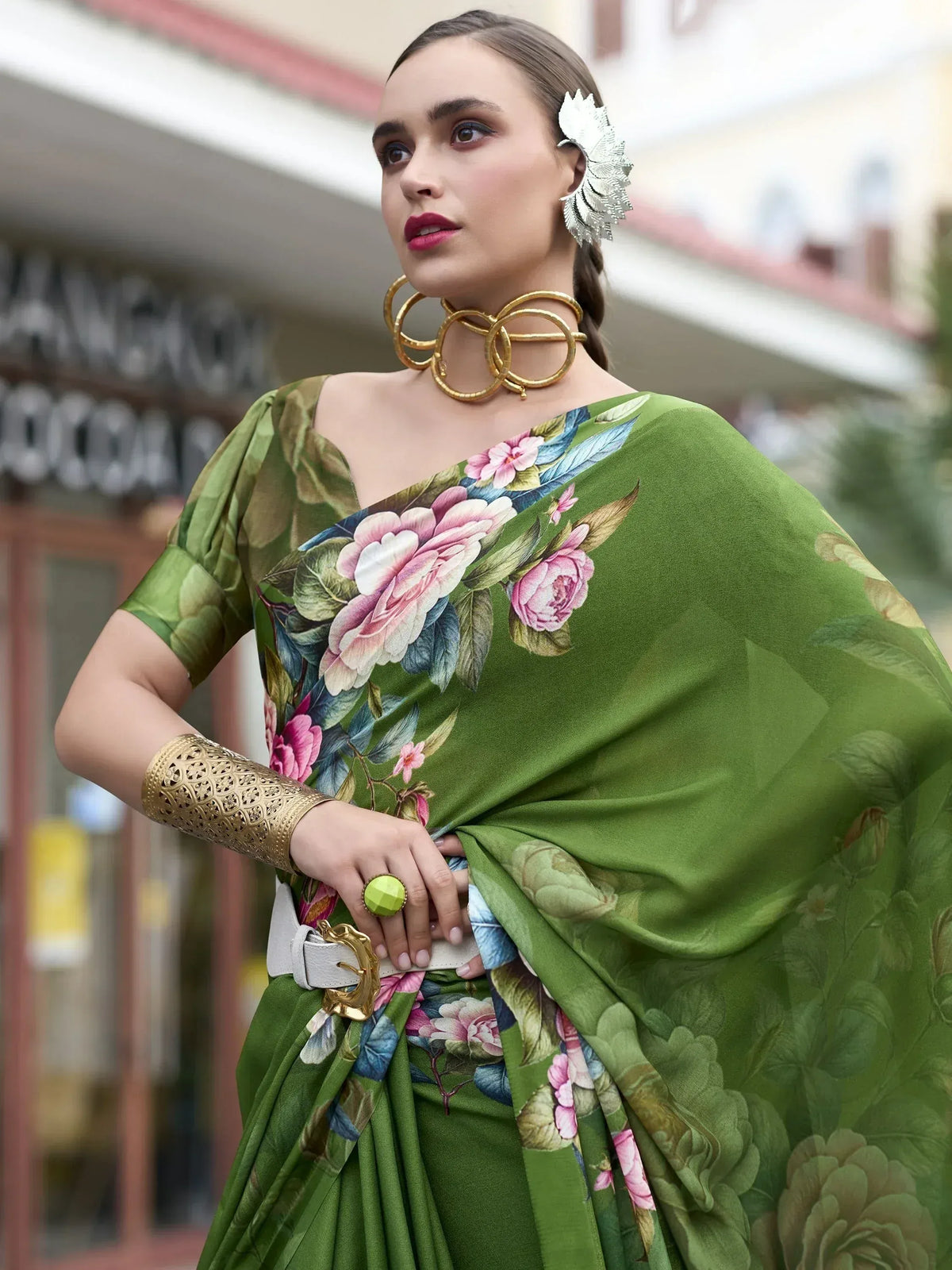 Green floral print saree with gold jewelry, perfect for ethnic wear and designer occasions.