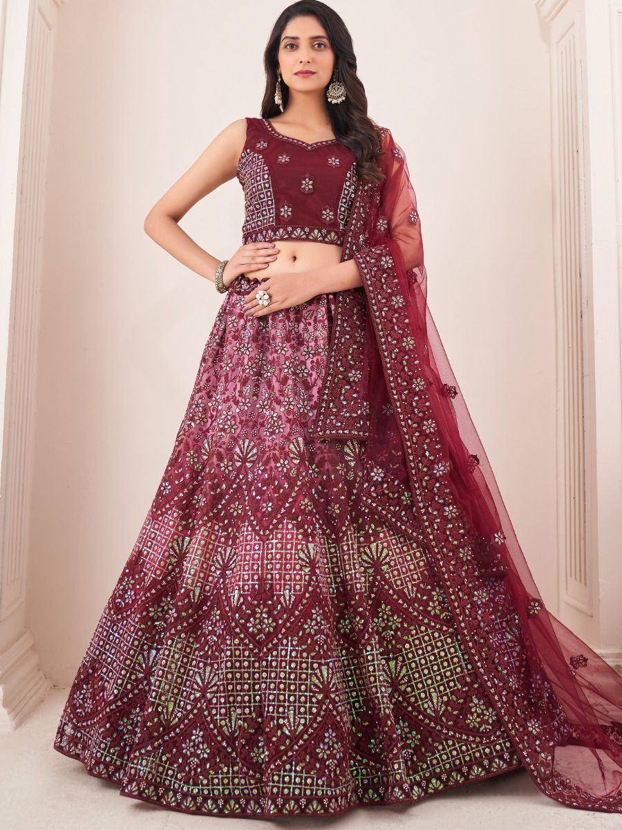 Maroon embroidered lehenga choli with floral patterns and sheer dupatta, perfect for Indian ethnic occasions.