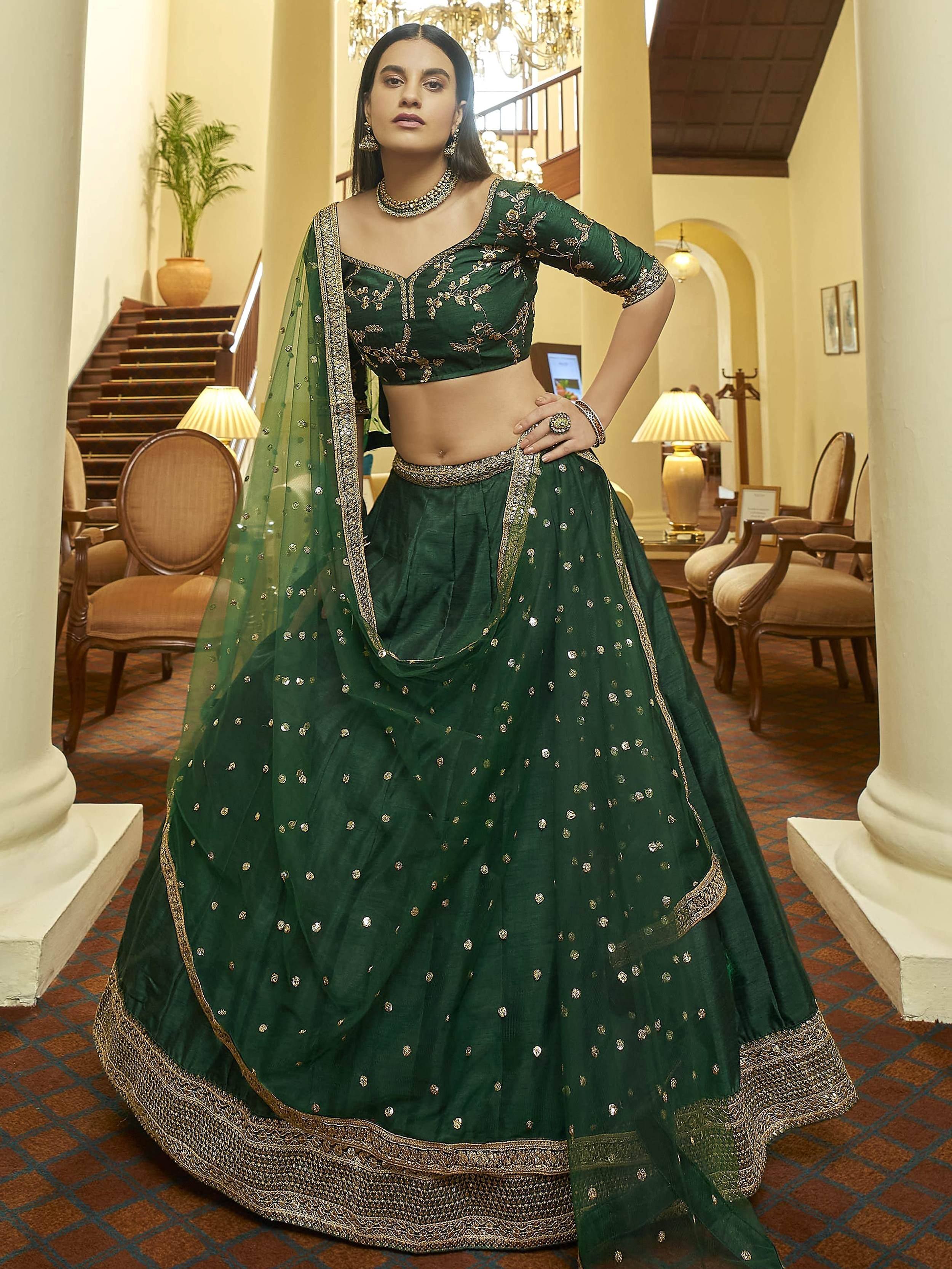 Emerald green designer lehenga choli with gold embroidery, perfect for Indian ethnic wear occasions
