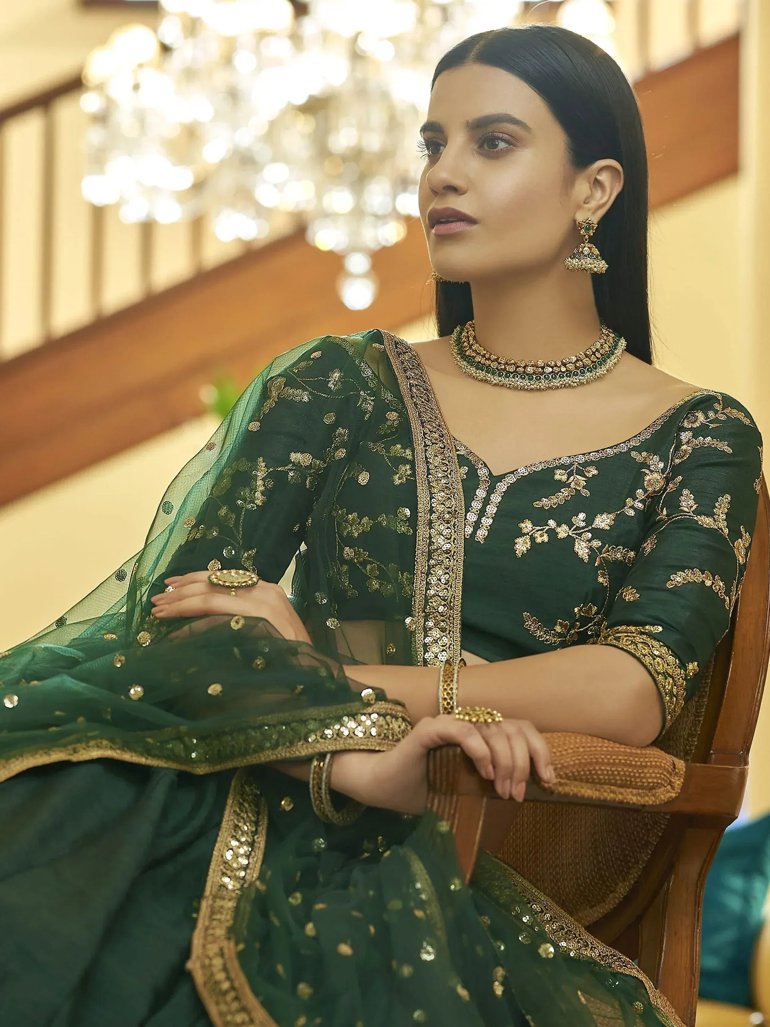 Elegant green designer lehenga choli with gold embroidery, perfect for Indian ethnic wear and festive occasions.