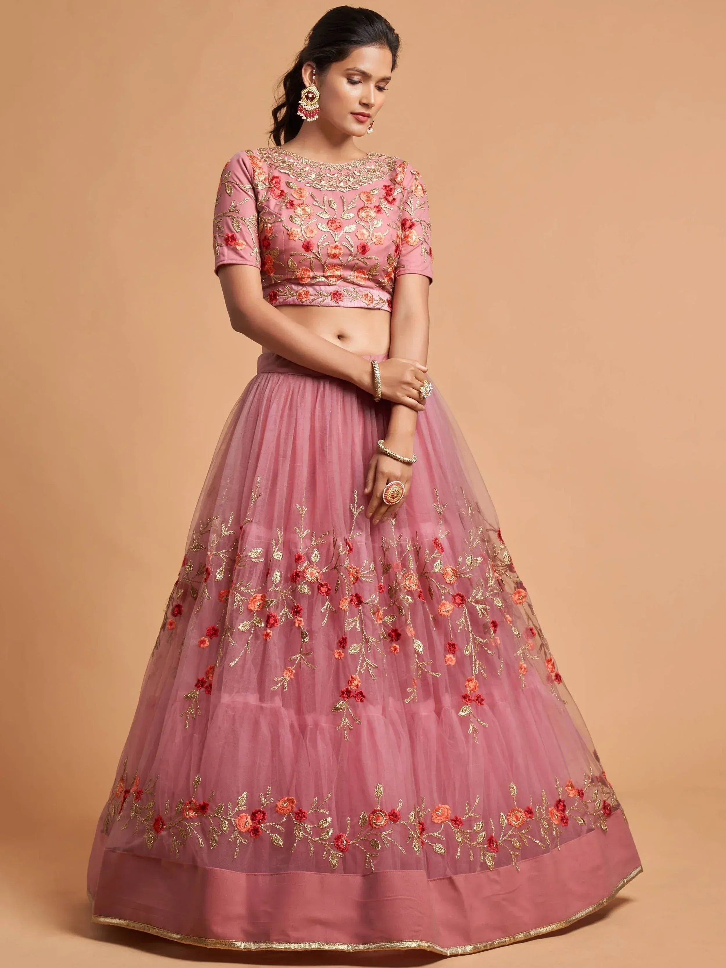 Pink floral embroidered lehenga choli with gold detailing, perfect for Indian ethnic occasions